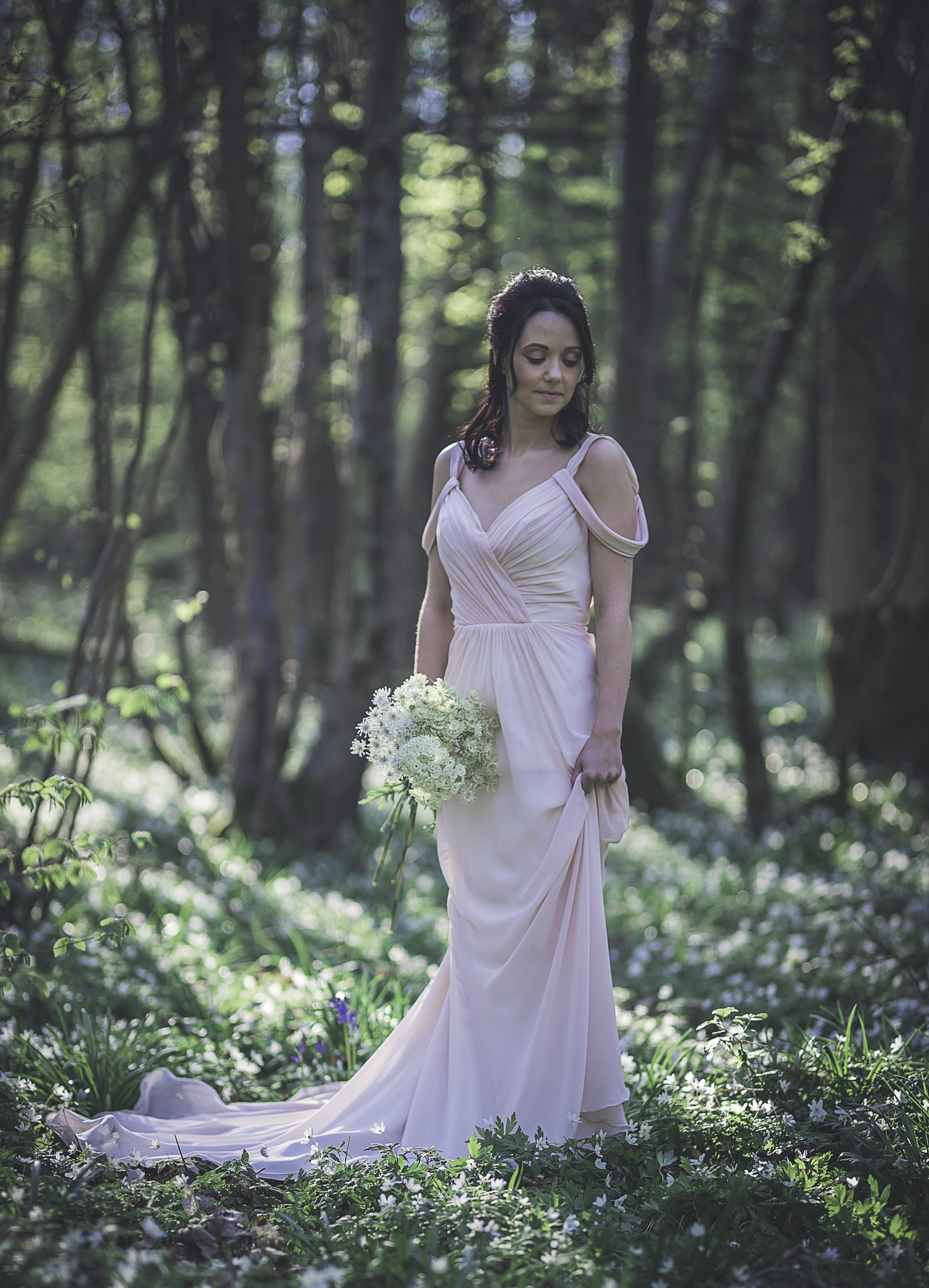 Bride in a pink dress in the woods