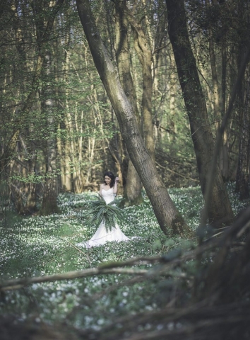 Bride deep in the woods at the Dreys