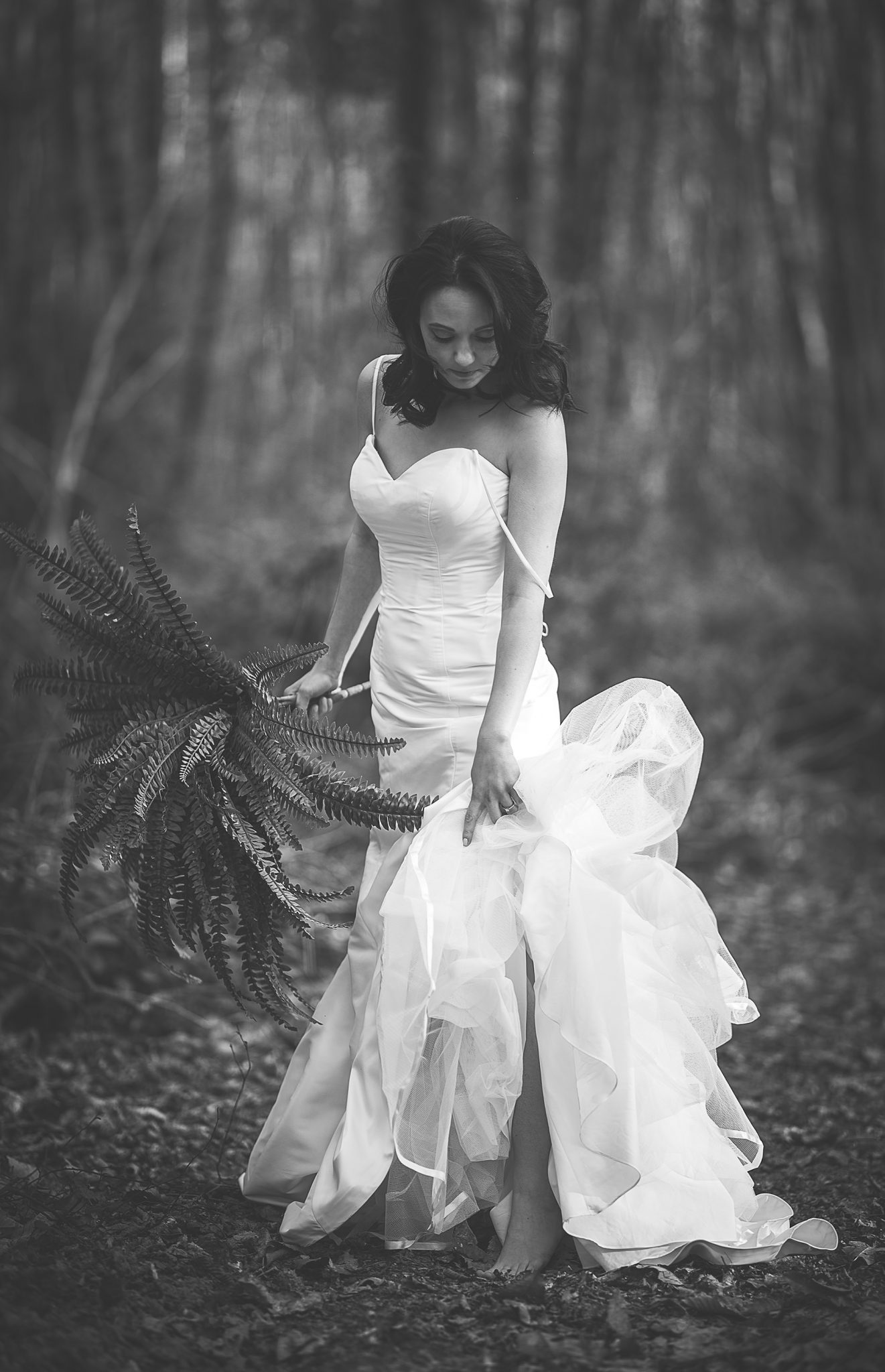 Bride barefoot in the woods at the Dreys