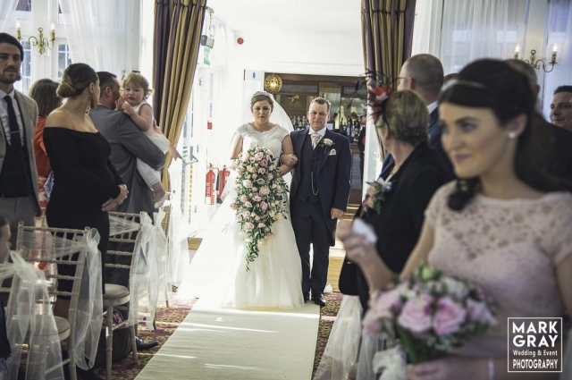 Bride and dad about to enter ceremony room at Chilston Park
