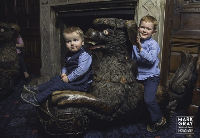 Two little boys riding the dragon at Chilston Park Hotel