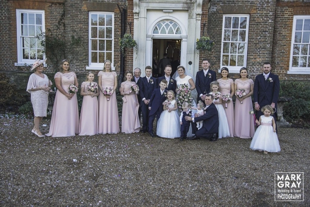 Bride and groom with bridesmaids, flower girls and groomsmen