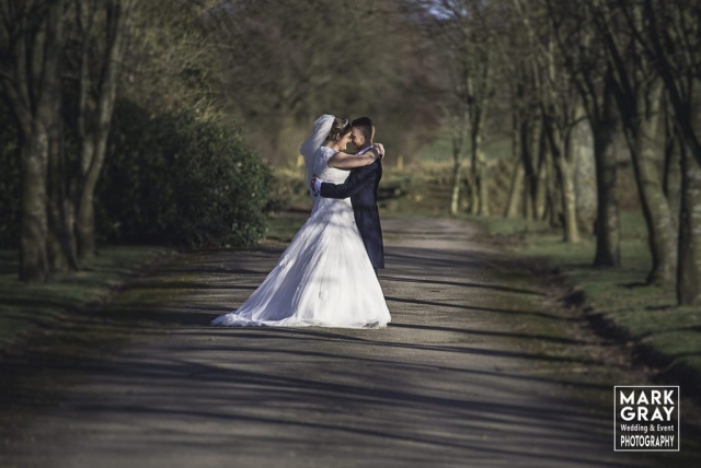 Bride and groom enjoy the surroundings in the grounds at Chilston Park Hotel