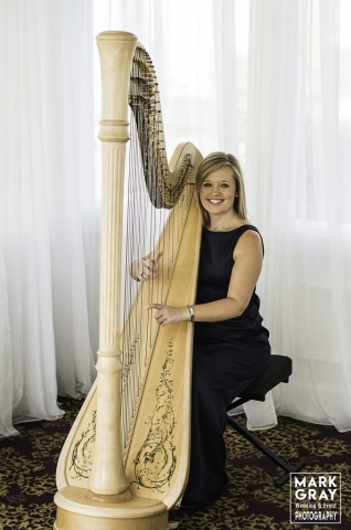 Nicola Veal with her harp providing background wedding music